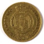 A George III gold half-guinea dated 1806, approximately 4.