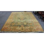 A Turkey style carpet with central green ground geometric field within a multi-figured border,
