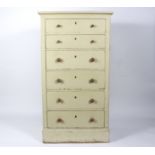 A painted chest of six long drawers, painted in cream,