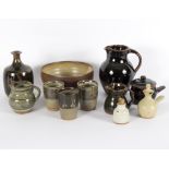 A quantity of mainly Winchcombe pottery, to include a tenmoku glazed jug,