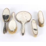 A silver five-piece part dressing set,