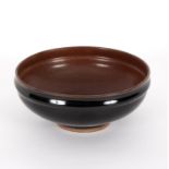 Charles Vyse (1882-1971)/Earthenware bowl/with a tenmoku glaze, signed and dated to base 1935,