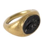 A Roman gold intaglio ring, the carved intaglio depicting the head of a classical male,
