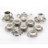 Seth Cardew (British 1934-2016)/Miniature dolls tea set/of six cups and saucers,