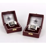 Two silver napkin rings, Asprey, London 1988, each in a fitted case,