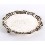 A silver salver, Birmingham, with pie-crust border and presentation inscription,