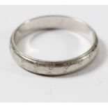 A platinum wedding band by Boodle & Dunthorne Ltd.