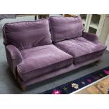 A modern purple velvet three seater settee, 188cm wide,