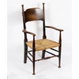 William Birch (early 20th Century)/Arts & Crafts oak framed open armchair with turned legs and a