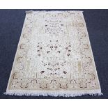 A cream ground rug, Tree of Life design within a floral border,