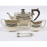 A bachelor's silver tea set, the teapot marked Tessier, London 1912,