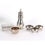 A silver sugar caster, Birmingham 1926, of pear shape, 18cm high, three matched oval silver salts,