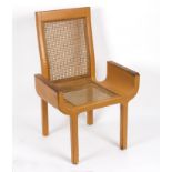 John Makepeace (British, born 1939)/Tan leather covered armchair,