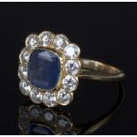 A sapphire cluster ring, the central cushion cut stone approximately 7.