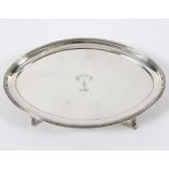 A George III silver teapot stand, Peter & Ann Bateman, London 1793, of oval form, crested,