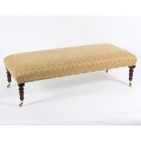 A rectangular footstool with upholstered seat on turned legs,