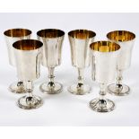 A set of six silver and silver gilt goblets, Birmingham 1976, 13cm high,