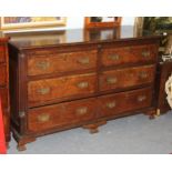 A George III oak mule chest, the hinged cover above two dummy drawers,