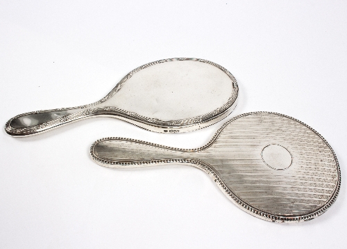 A silver-backed hand mirror,