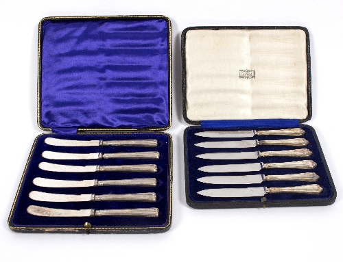 Two sets of six silver handled fruit knives,