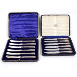 Two sets of six silver handled fruit knives,