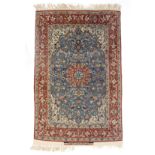 An Isfahan rug with pale blue field, signed,