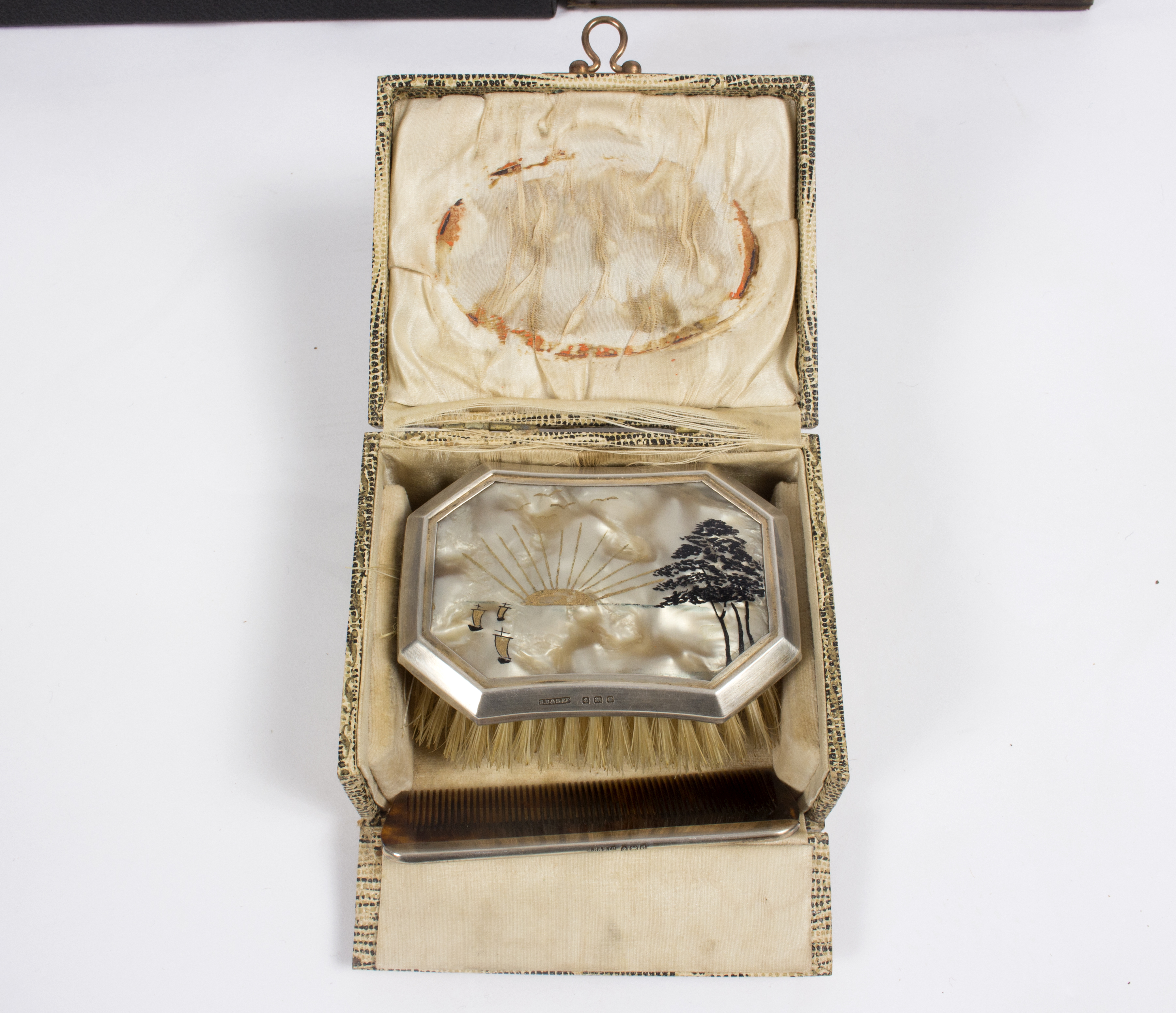 A silver three-piece dressing set with repoussé decoration, in fitted case, - Image 2 of 2