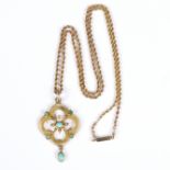 An Edwardian turquoise and seed pearl pendant of quatrefoil shape on a fine link 9ct gold neck