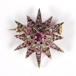 A ruby starburst brooch/pendant, with removable pin,