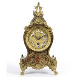 A tortoiseshell and gilt brass eight-day mantel clock of Boulle design,
