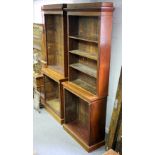 A pair of 19th Century mahogany bookcases with adjustable shelves and reeded columns,