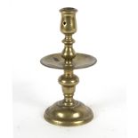 A brass Heemskerk candlestick, 22.