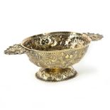 A Dutch silver gilt brandy bowl (brandewijnskoppen) of embossed oval form with flat pierced mask