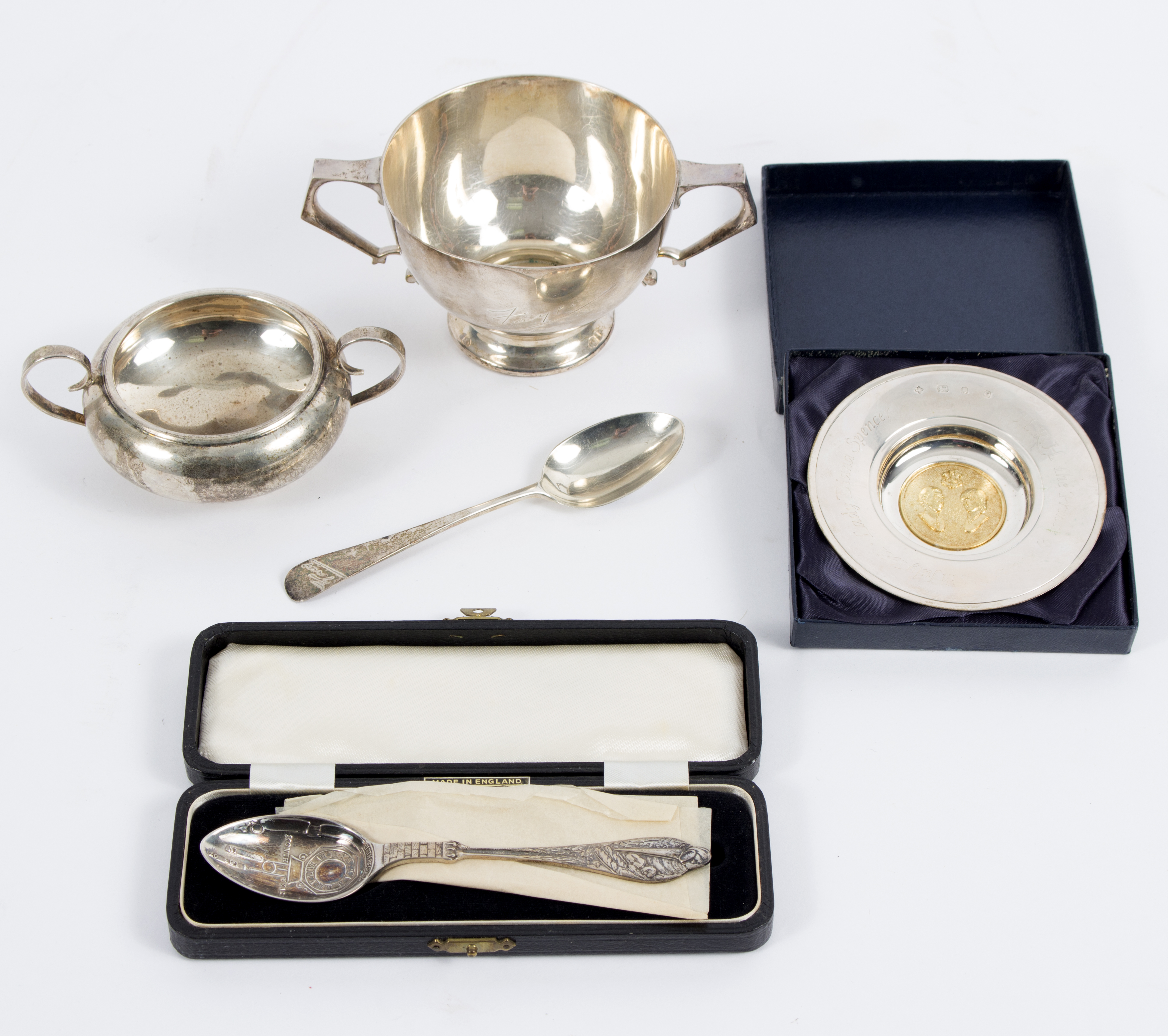 A silver porringer and spoon, W & W, London 1926, inscribed, a two-handled bowl,