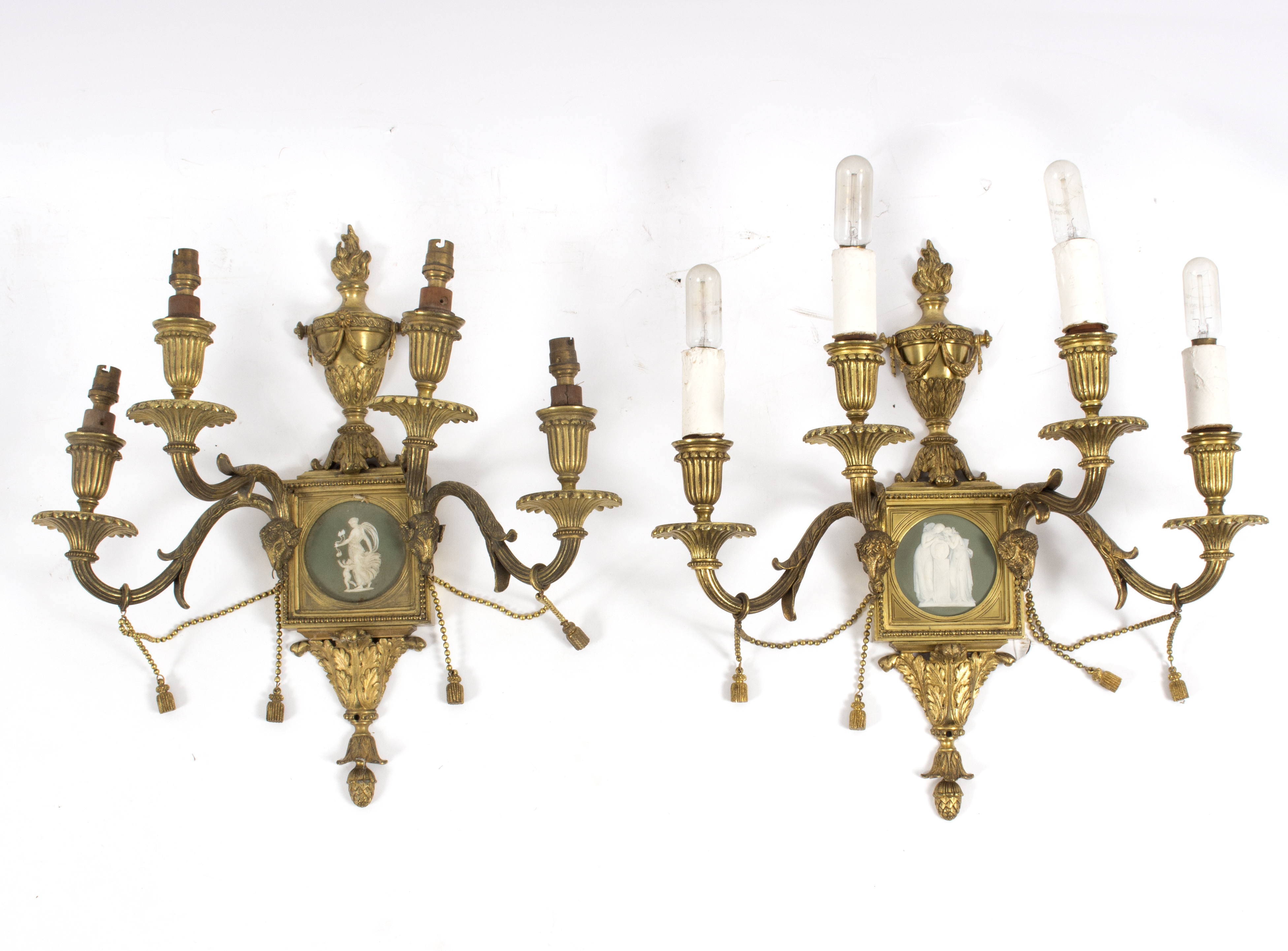 A set of six four-branch gilt metal wall lights,