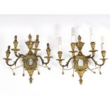 A set of six four-branch gilt metal wall lights,