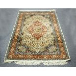 An Isfahan rug, with all over floral design on a cream ground,
