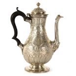 A Victorian silver coffee pot, Charles Stuart Harris, London 1879, with Eastern style decoration,