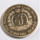 A 22ct gold coin commemorative of the marriage of Prince Charles and Lady Diana Spencer,