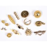 A group of Victorian gold and gilt metal jewellery to include a circular brooch set diamonds and a