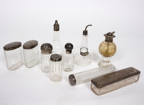 A quantity of silver mounted glass scent bottles, a bitters pourer etc.