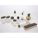 A quantity of silver mounted glass scent bottles, a bitters pourer etc.