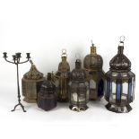 Six metalware lanterns, some with coloured glass pendants,