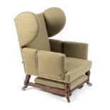 A late 19th Century wingback reclining armchair, possibly Foot's Patent, with adjustable back,