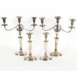 Four Sheffield plate candlesticks of Adam style, two with three-light, two-branch attachments, 30.