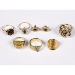 An 1874 gold coin ring to an 18ct gold mount, a diamond set buckle type ring, a 9ct gold rose ring,