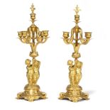 A pair of gilt metal four-branch five-light candelabra,