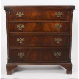 A reproduction bachelor's chest, the fold-over top above four drawers on bracket feet,