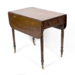 A George IV mahogany two-flap Pembroke table on turned legs, 76.