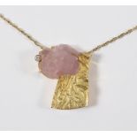 An 18ct gold, rose quartz and diamond pendant, of modern design, marked Handmade and monogrammed GB,